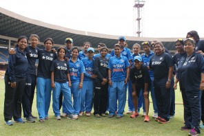 A Group of Women Cricketers in Blue Uniforms